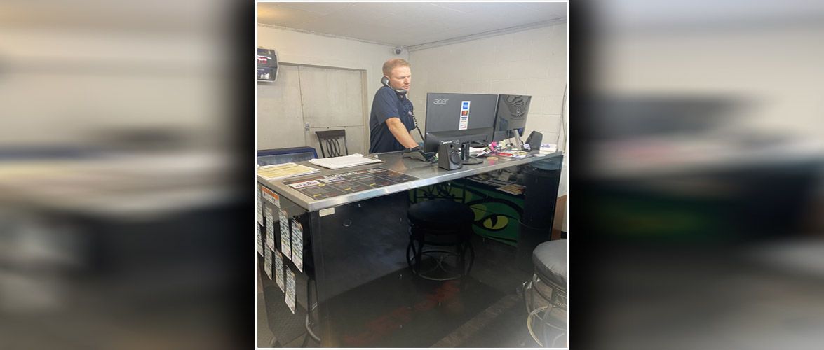 One of our mechanics talking on the phone | Alpine Automotive Service