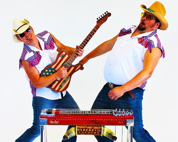 Two men in cowboy hats play guitars beside a keyboard on a white background