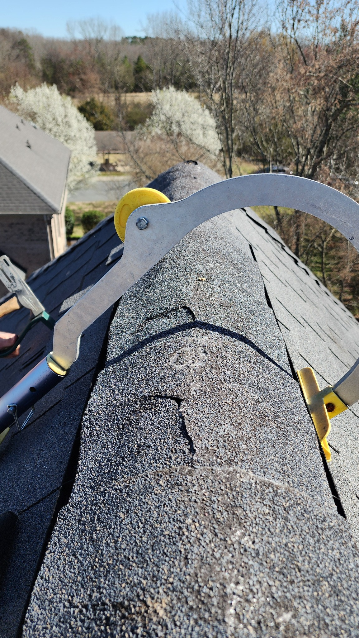 A person is cutting a roof with a saw.