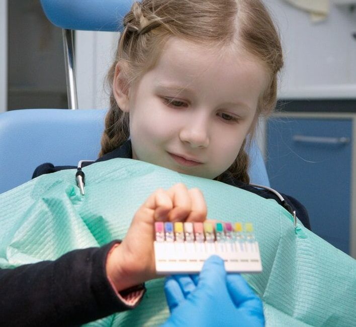 A Little Girl Is Getting Her Teeth Examined By A Dentist — Mittagong Dental Care In Mittagong, NSW