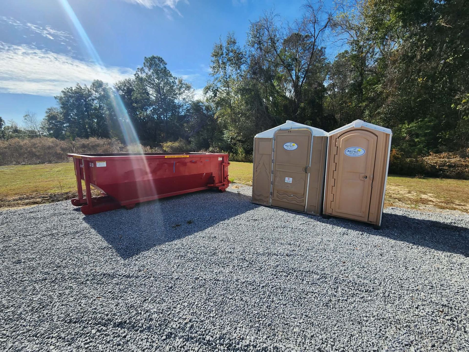 12-yard Double O & Co roll off dumpster at a small jobsite