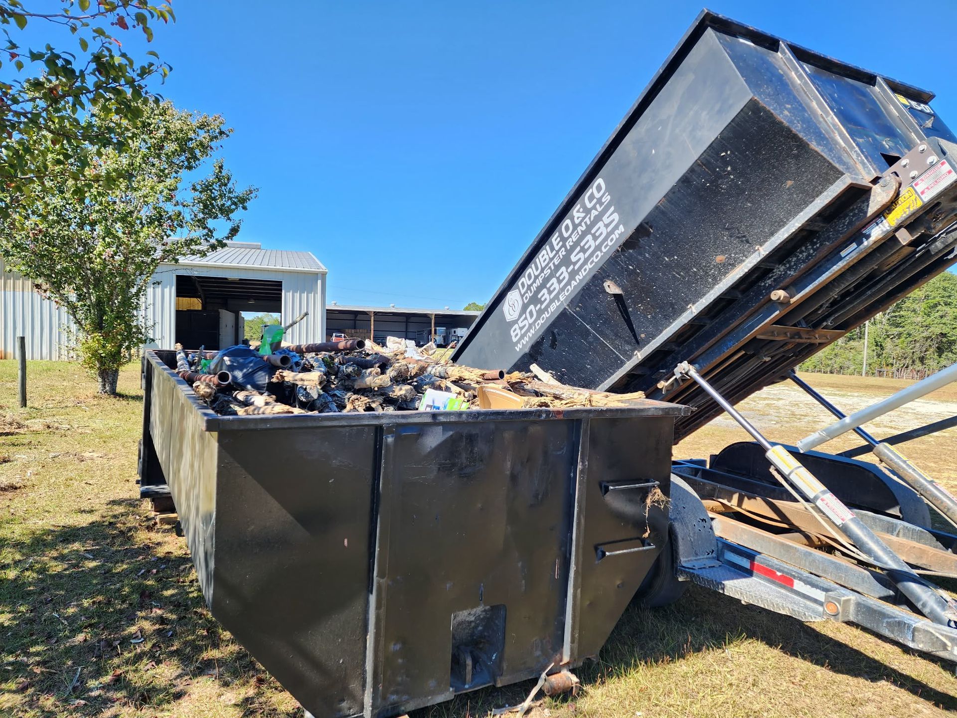 Double O & Co 15-yard dumpsters during a farm cleanup