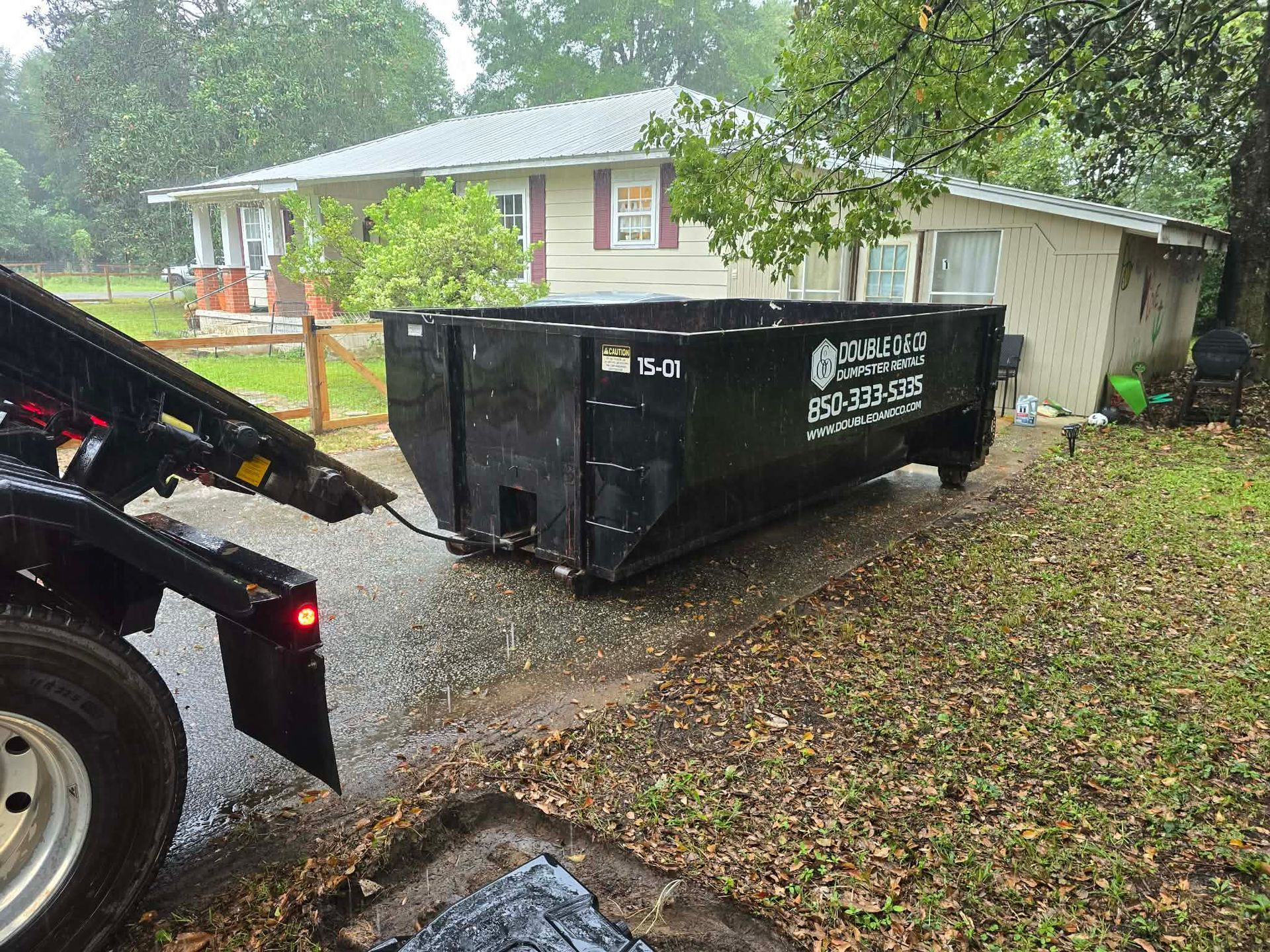 15-yard Double O & Co roll off dumpster at a residential property