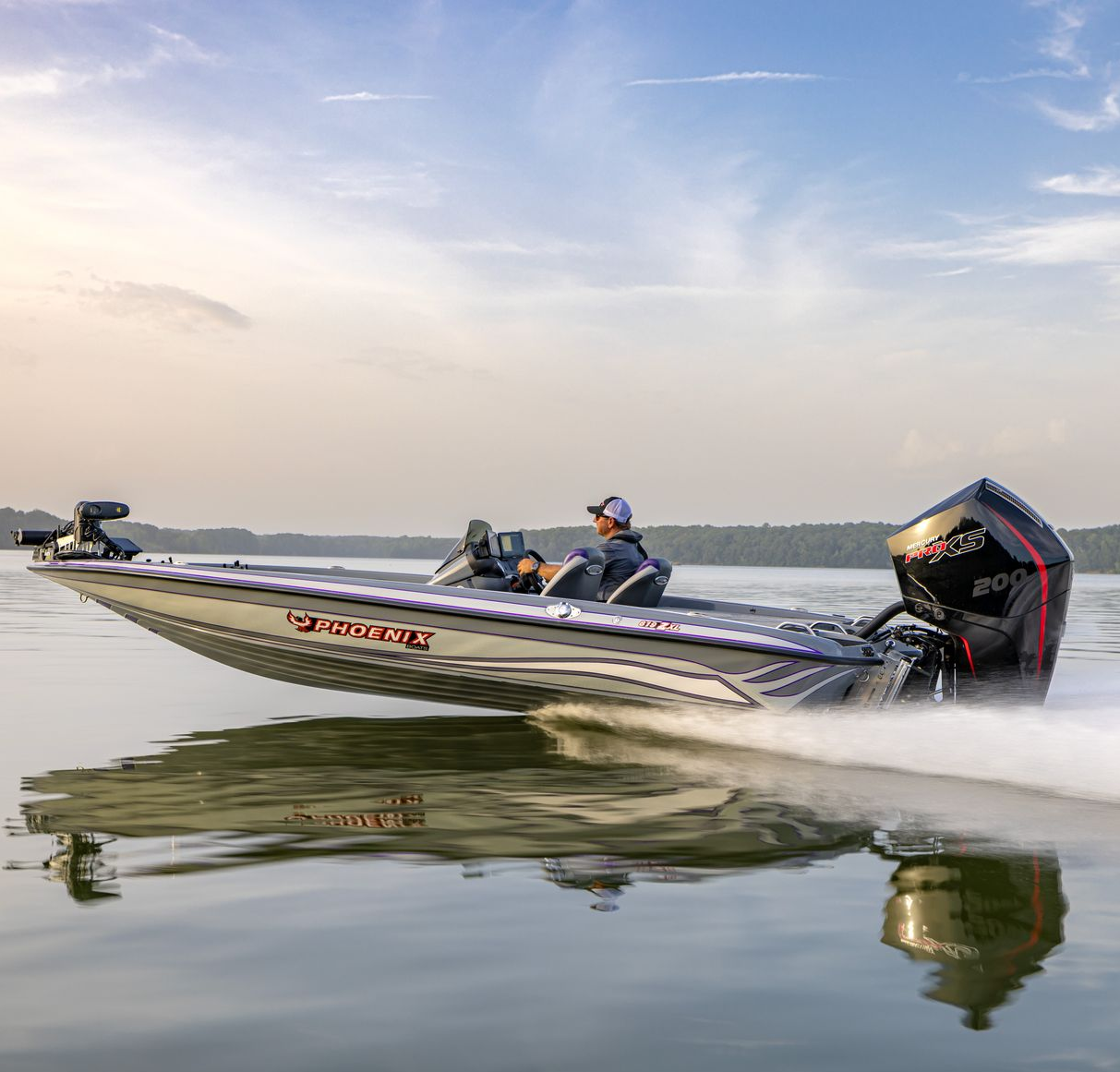 Speedboat skimming across calm water at sunrise, with two people aboard and a wake behind it