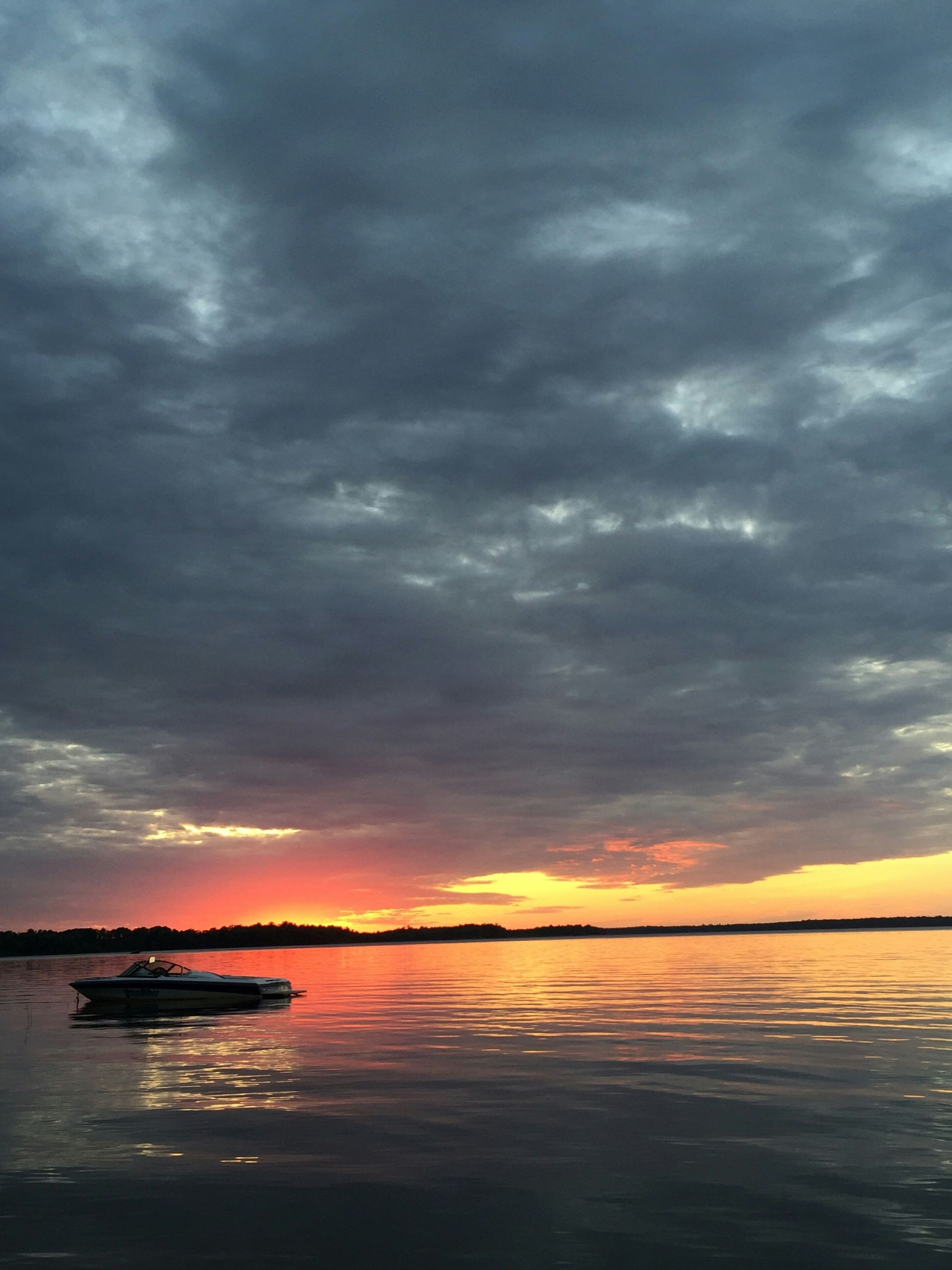 Boat on a calm lake at golden hour near Bemidji, Minnesota