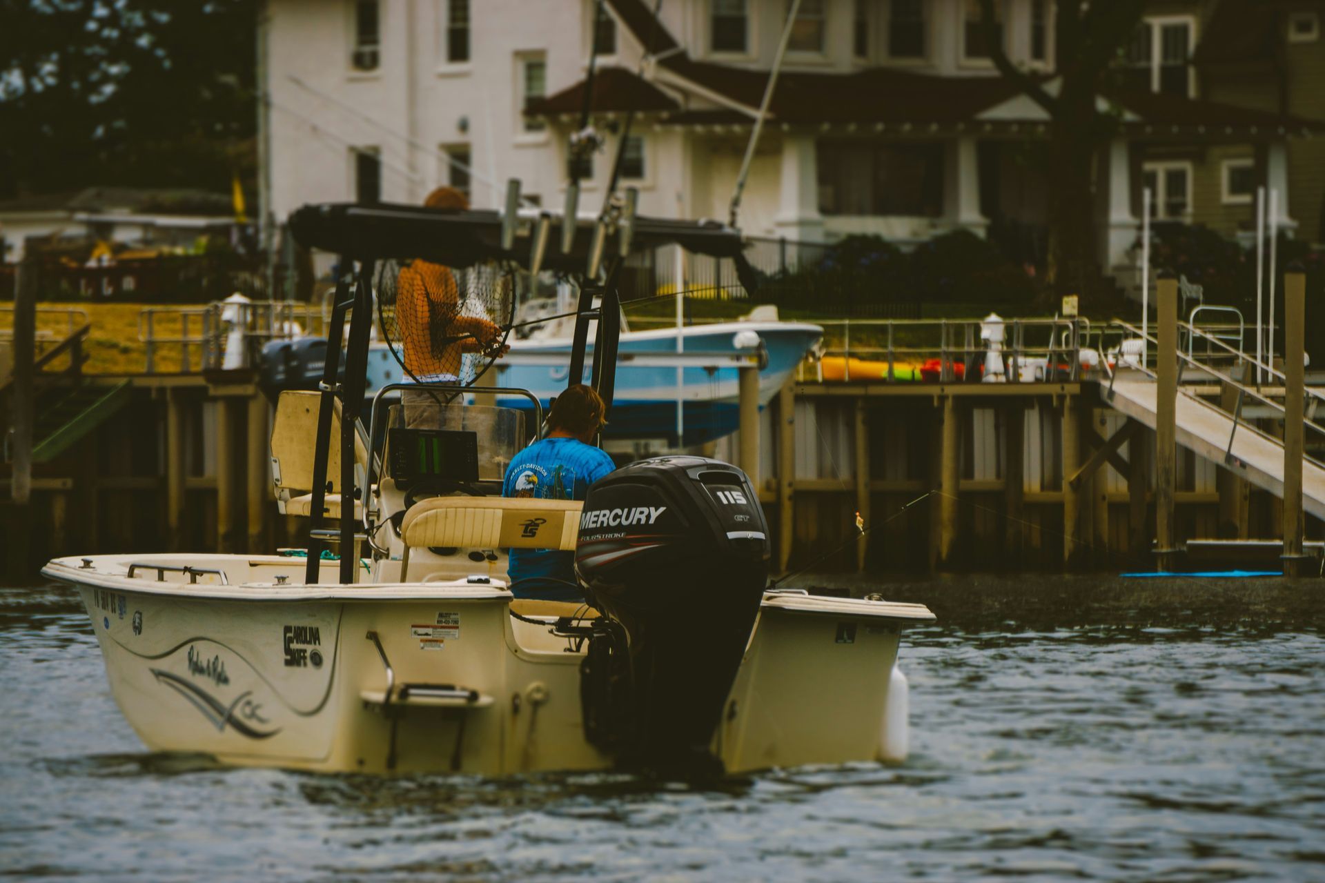 White and blue fishing boat on the water at Belmar, New Jersey