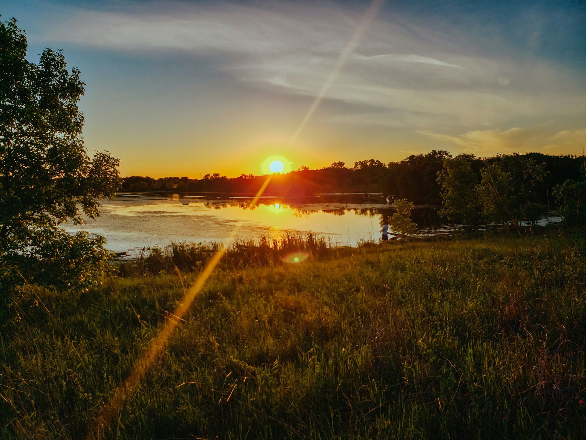 Fishing at sundown on Walnut Creek Lake near Papillion, Nebraska