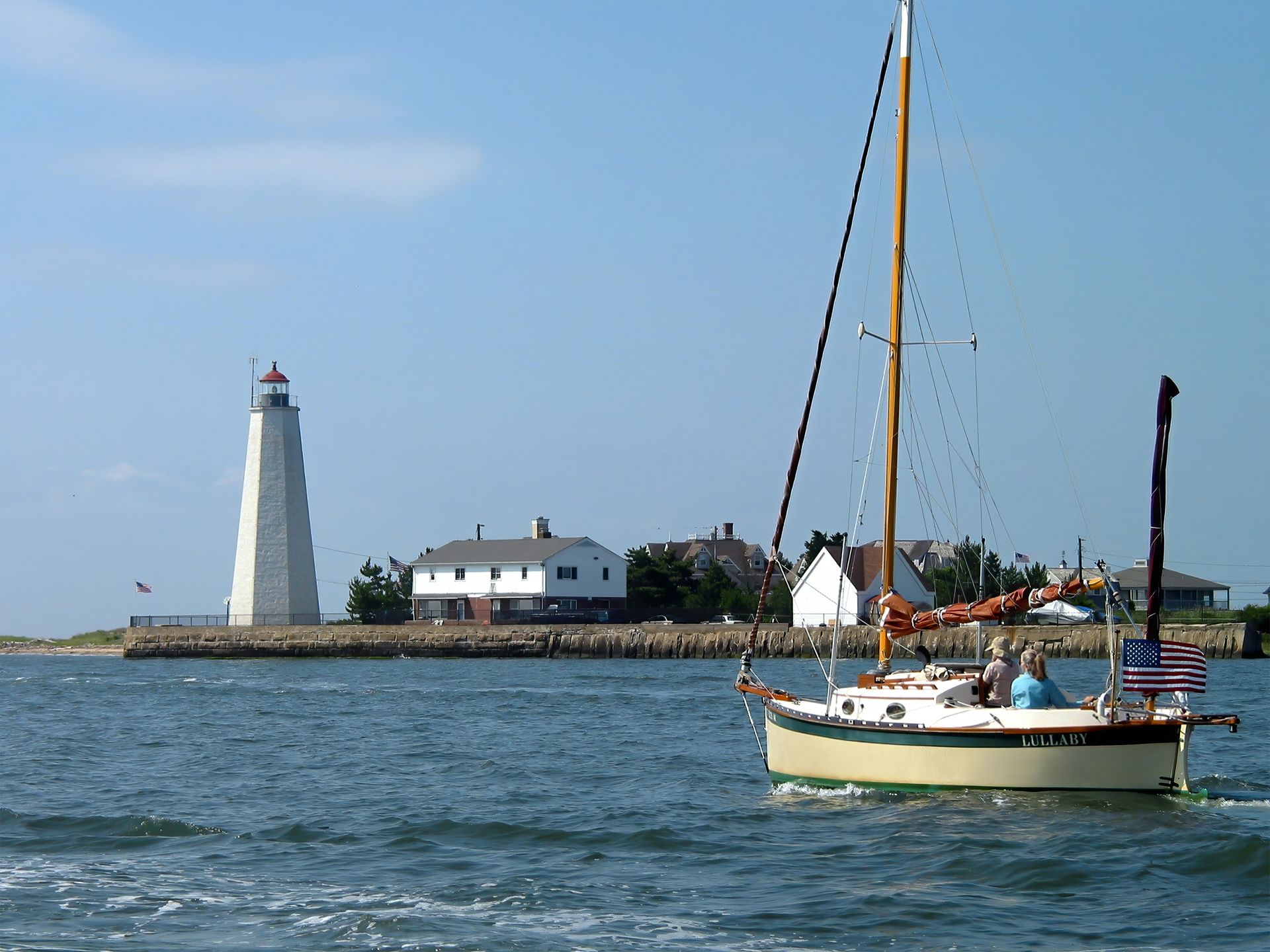 Sailboat leaving the mouth of the Connecticut River at Old Saybrook, Connecticut