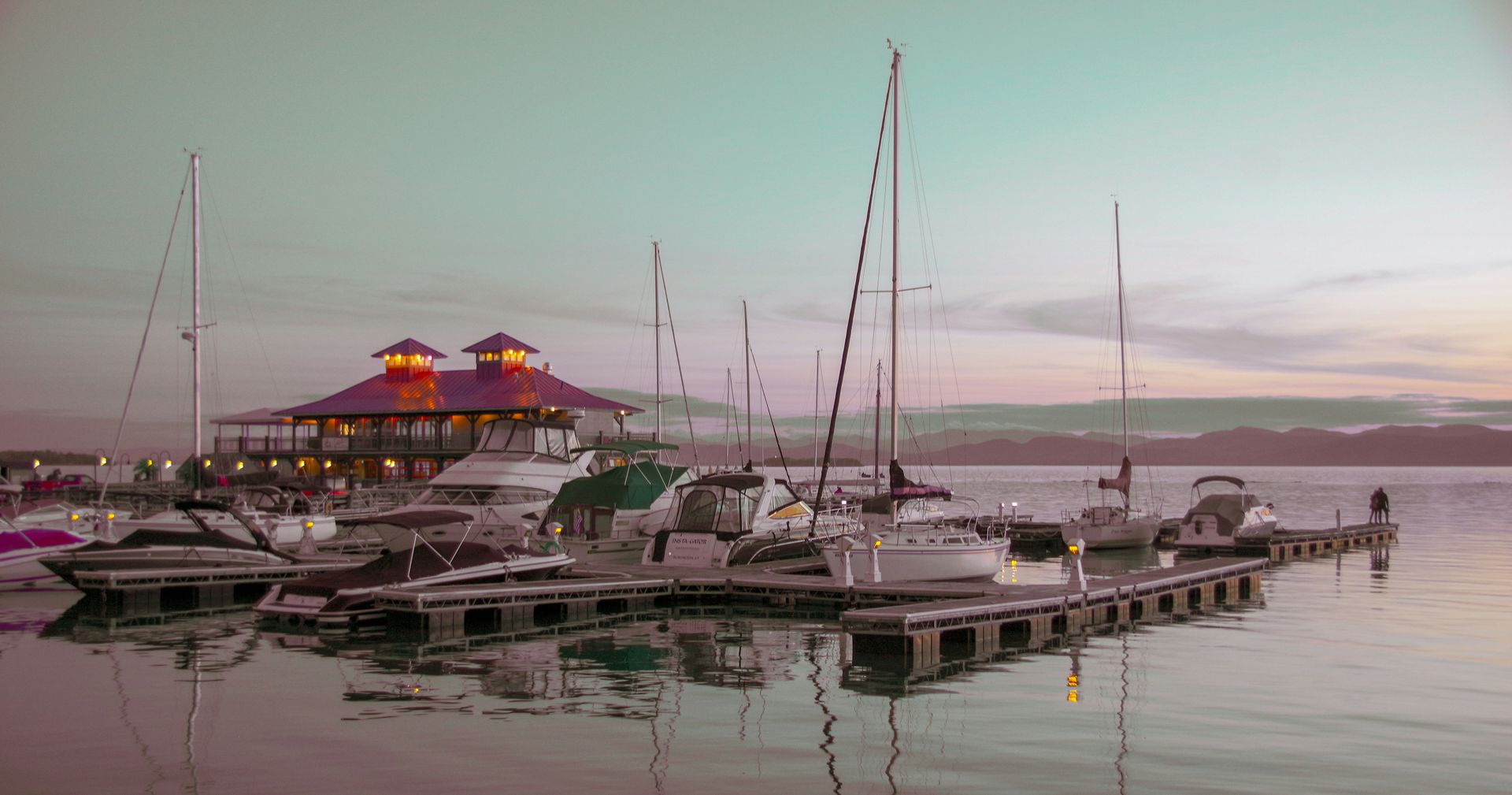 Sailboats docked on Lake Champlain in Burlington, Vermont at sunset