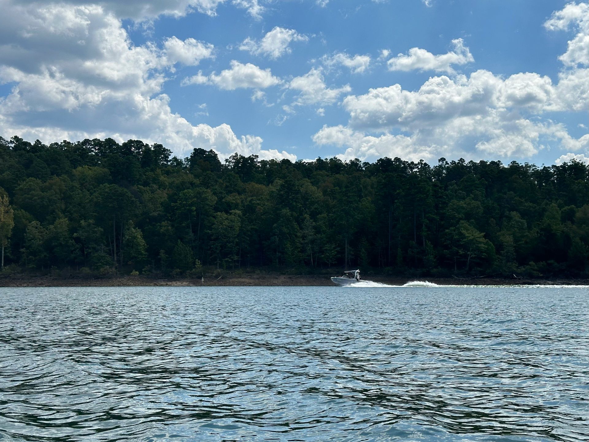 Motorboat crossing Lake Ouachita near Hot Springs, Arkansas