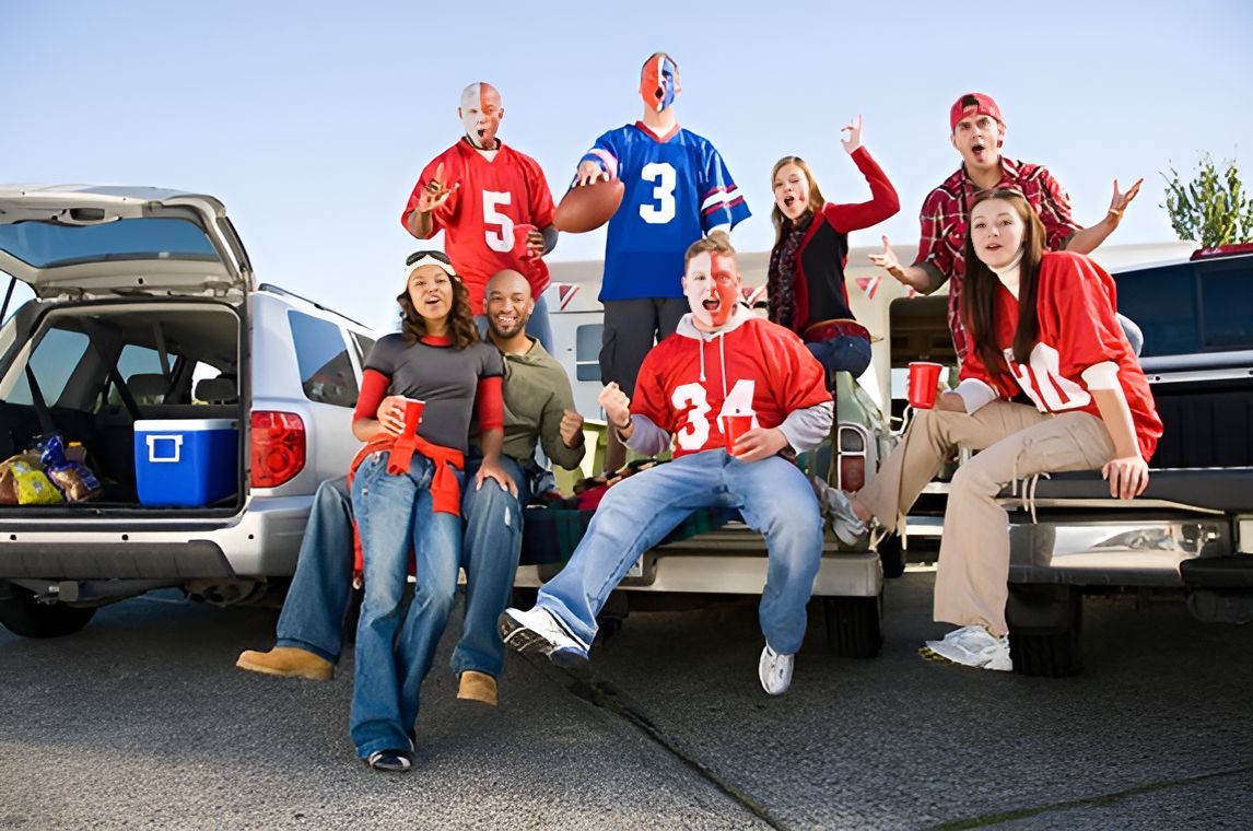 A group of people are sitting on the back of a truck