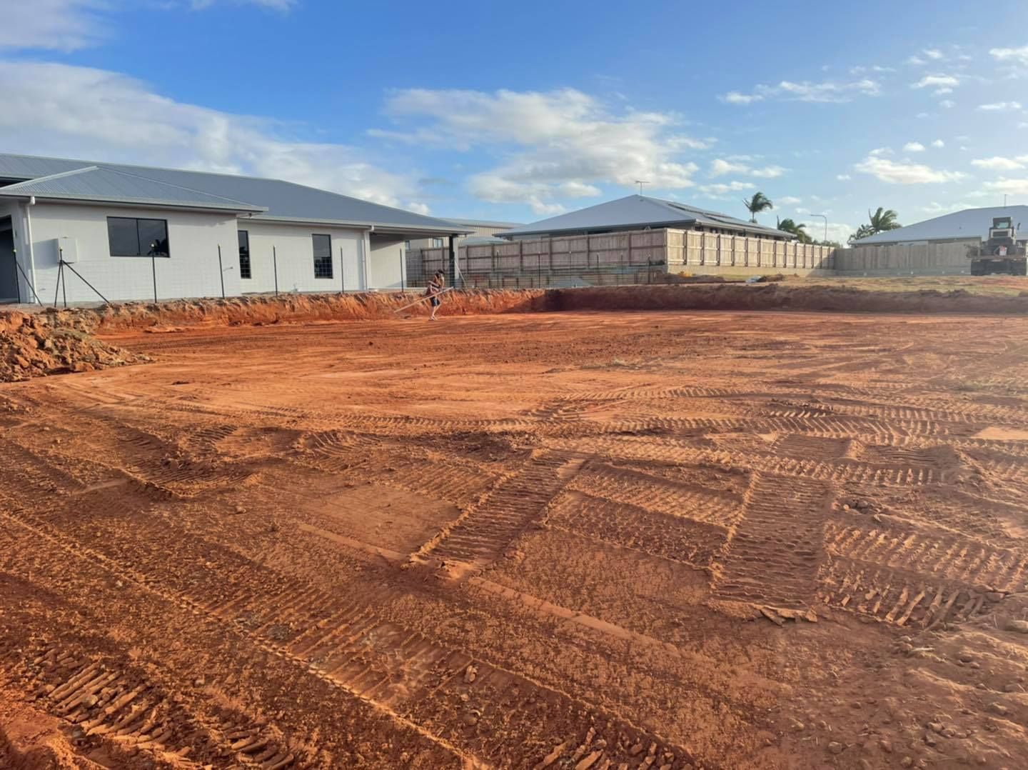 Dirt Lot in Front of Houses Under Construction — Bailey's Bobcat & Excavator Hire In Dumbleton, QLD