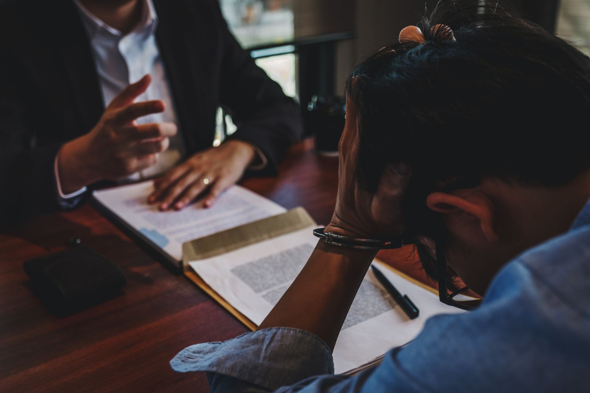 Criminal defense attorney with client]