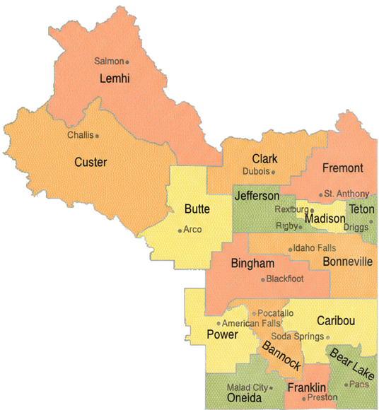 Map of Idaho counties, color-coded, labeled with county names like Lemhi, Custer, and Bingham.