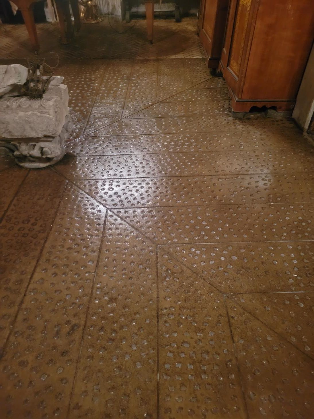 A close up of a tiled floor in a room.