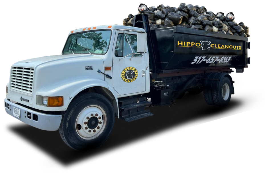 Hippo dumpster truck filled with garbage