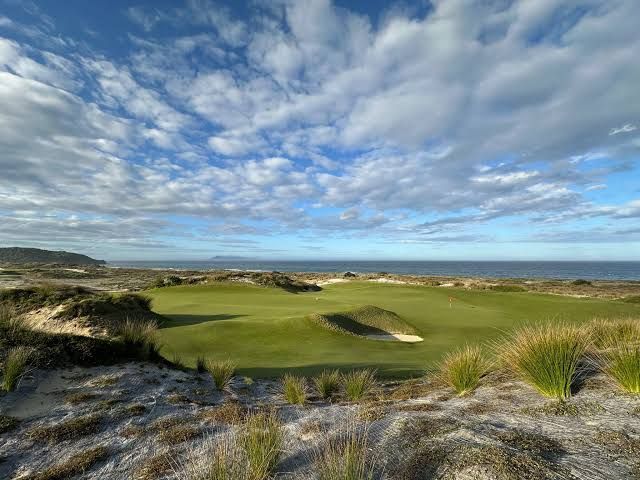 Steep-faced bunkers guarding a contoured green on the West Course at Royal Melbourne in Australia's