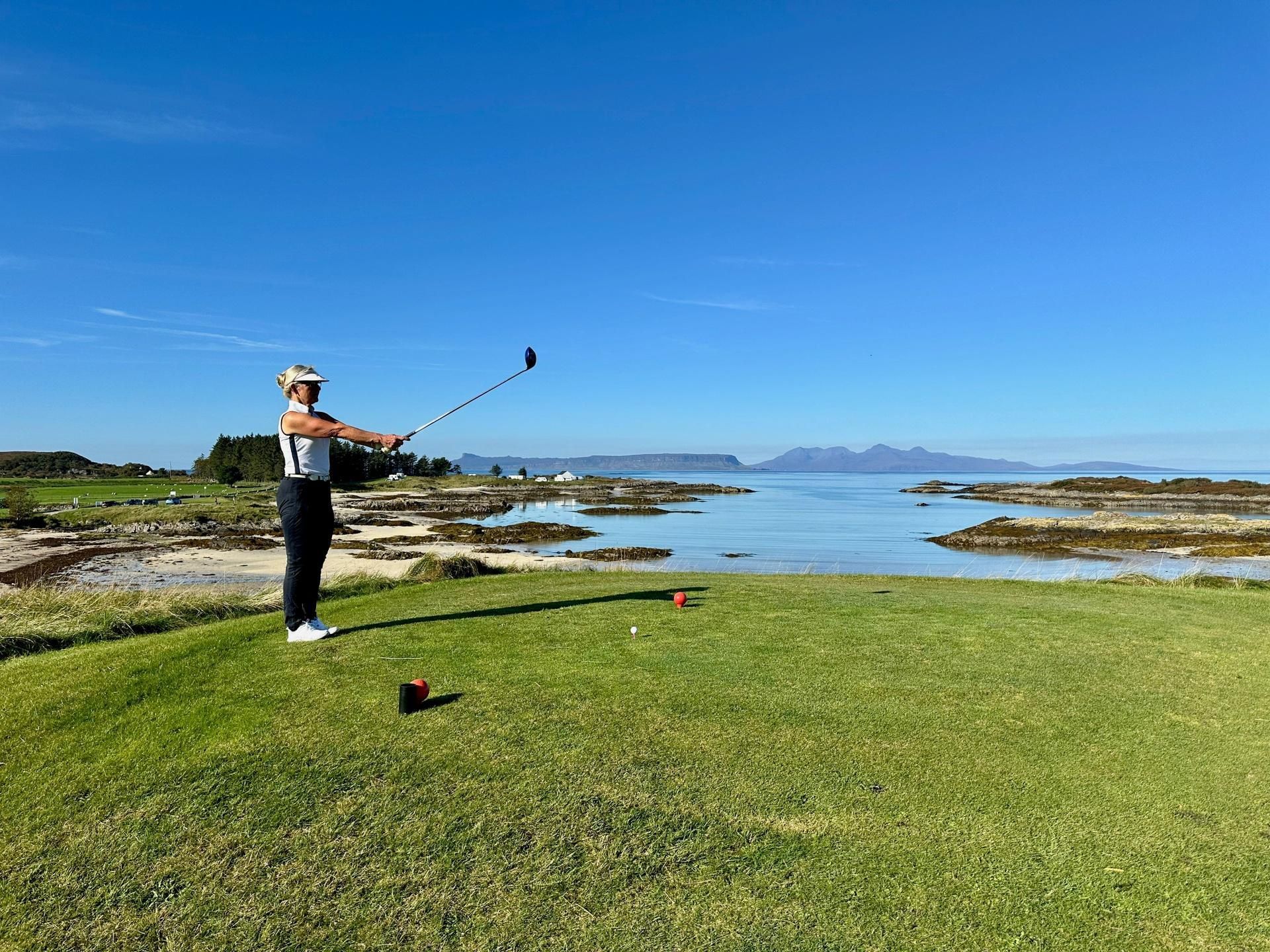 lady golfer getting ready to hit tee shot in scandinavia