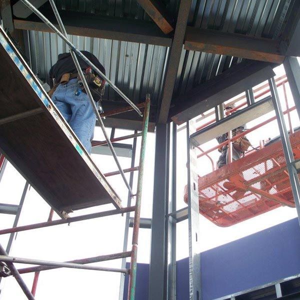 Worker on Lifting Machine — Kings Mountain, NC — Coleman Contractors Inc Worker on Lifting Machine — Kings Mountain, NC — Coleman Contractors Inc