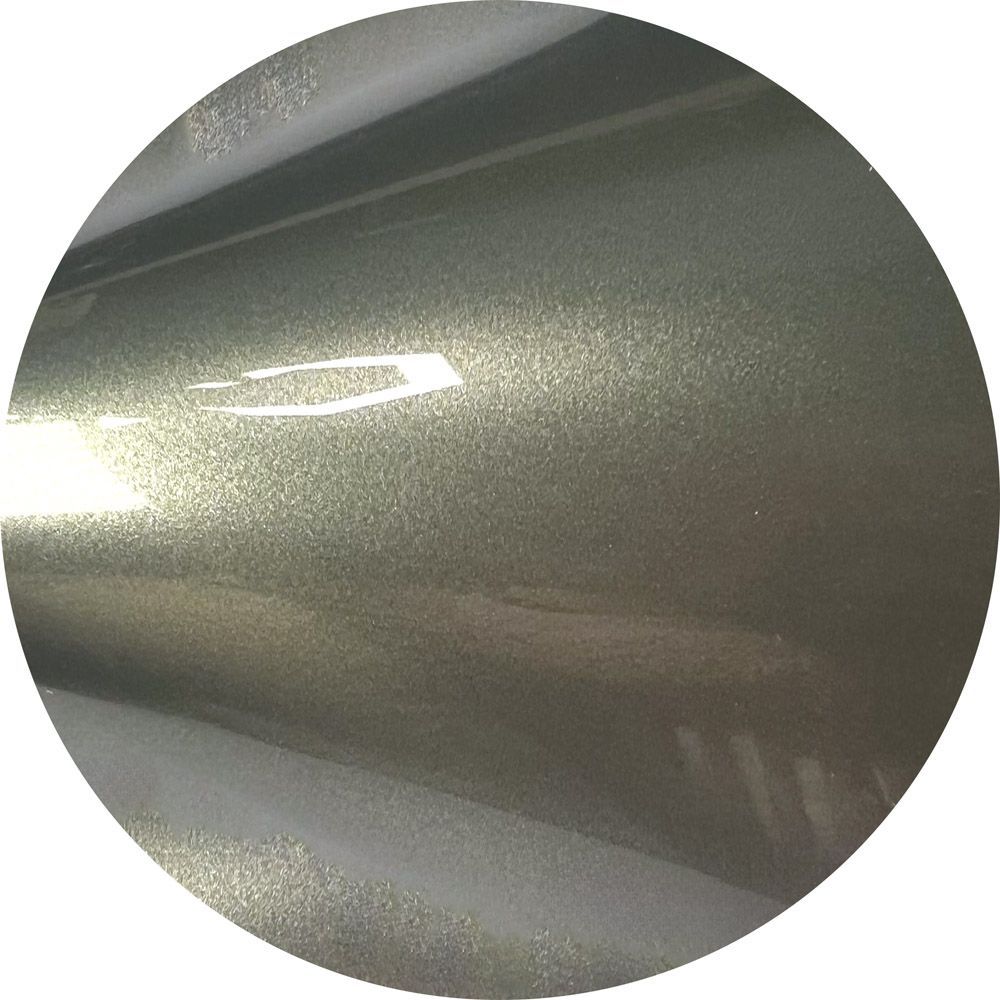 A close up of a metal surface in a circle