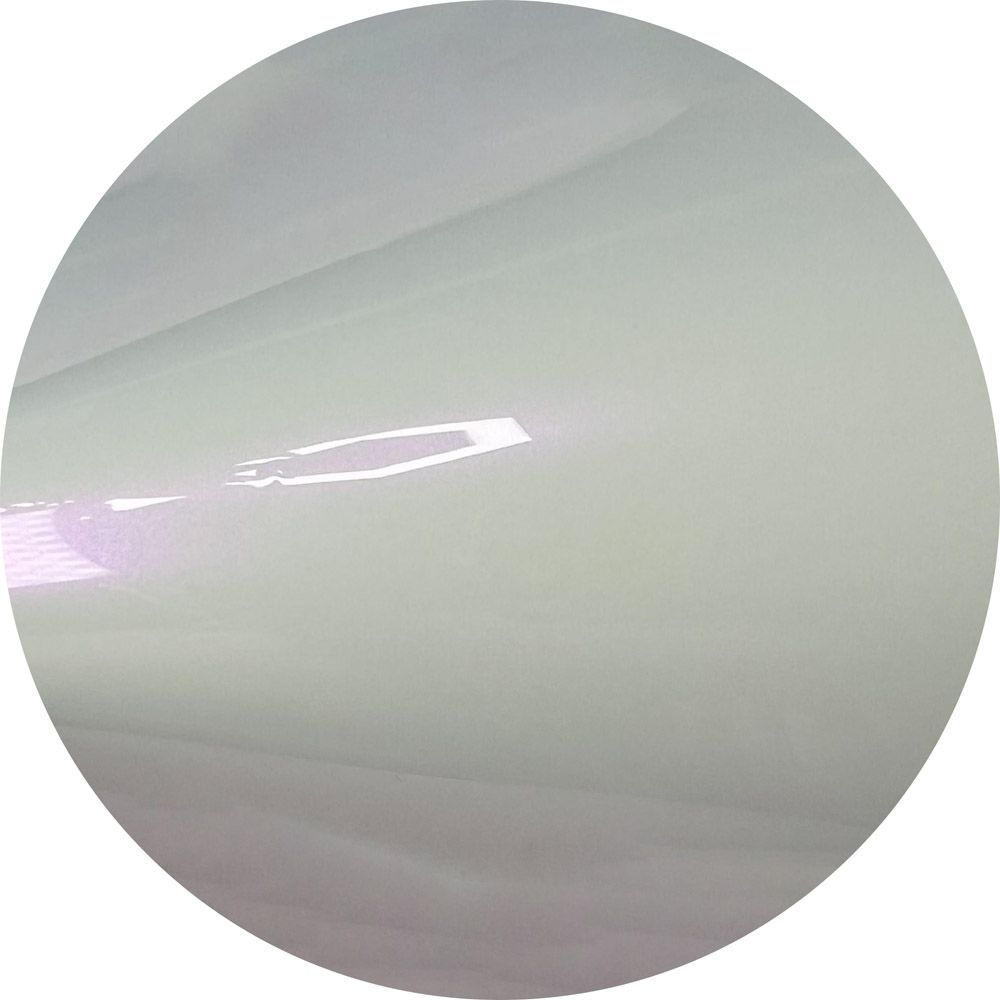 A close up of a piece of white paper in a circle.