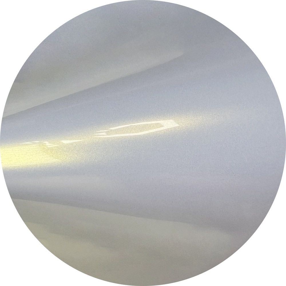 A close up of a piece of white paper in a circle