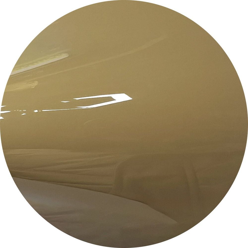 A close up of a brown circle on a white background