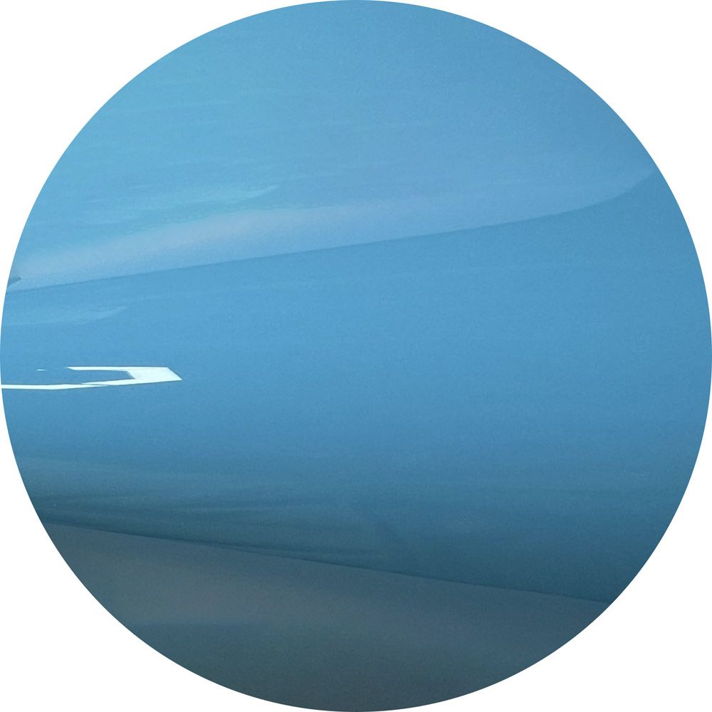 A blue circle with a white border on a white background