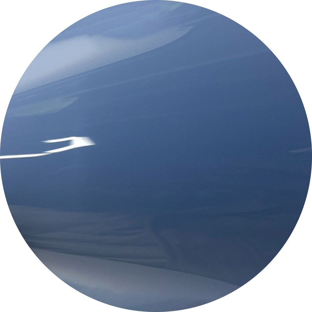 A blue circle on a white background with a reflection