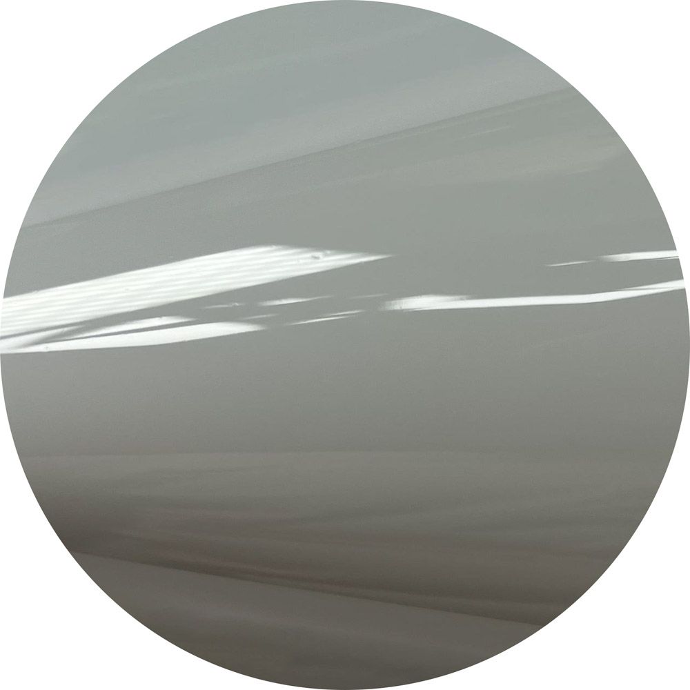 A close up of a white circle on a white background