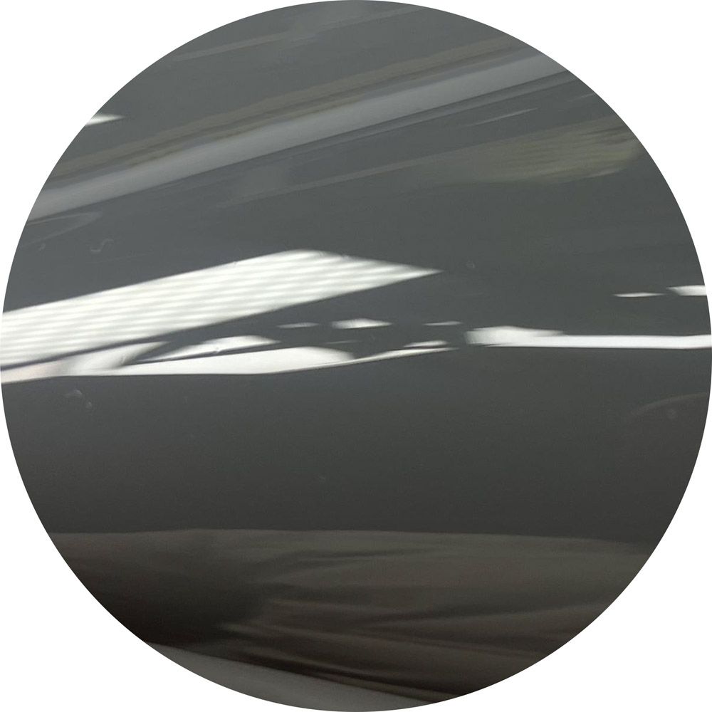 A circle with a reflection of a ceiling in it