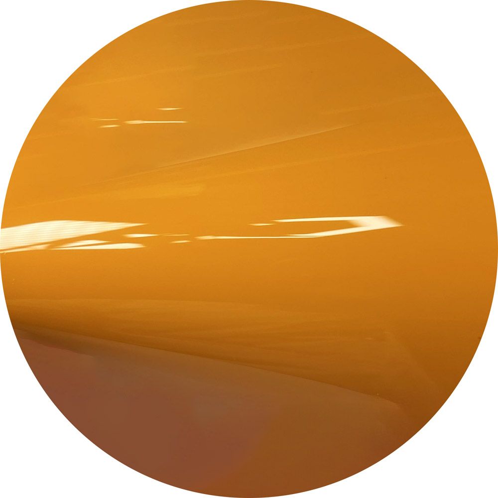 A close up of a yellow circle on a white background