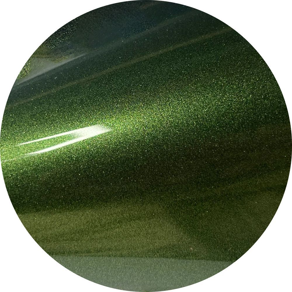 A close up of a green circle with a white background