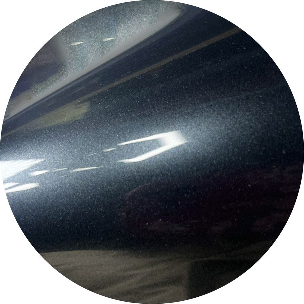 A close up of a black circle with a white border