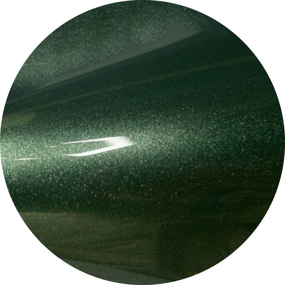 A close up of a green circle on a white background