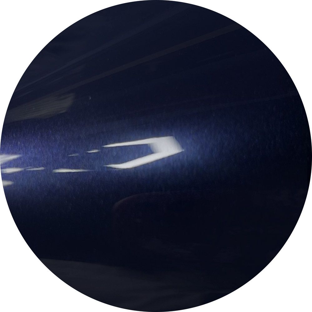 A dark blue circle with a white arrow on it