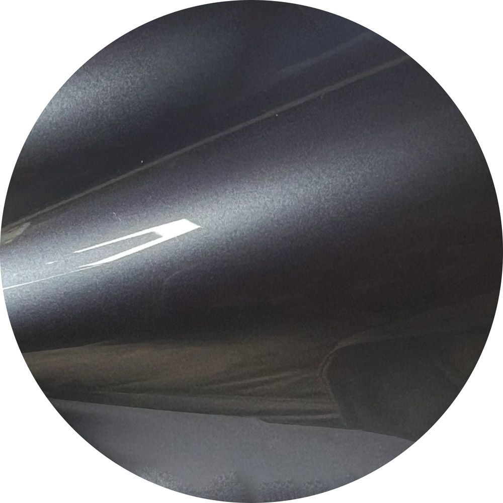 A close up of a black circle with a white background