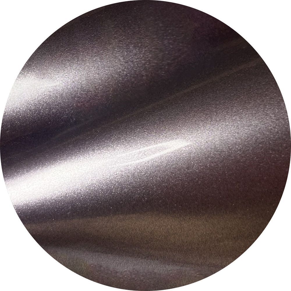 A close up of a metal surface in a circle
