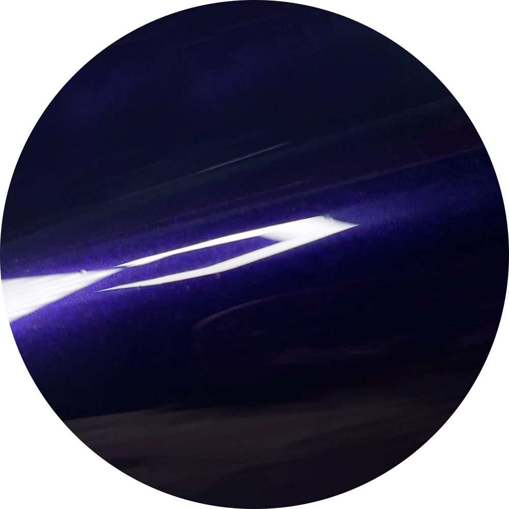 A purple circle with a light coming out of it