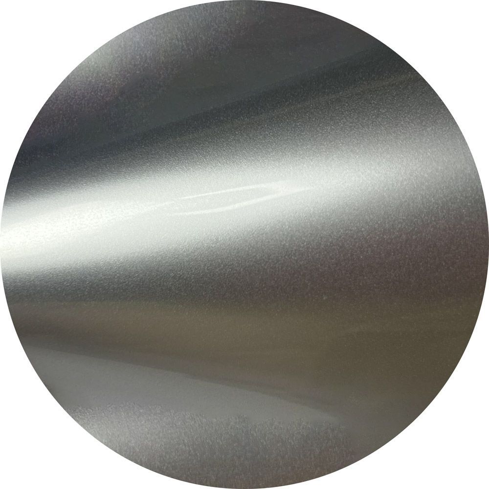 A close up of a silver circle on a white background