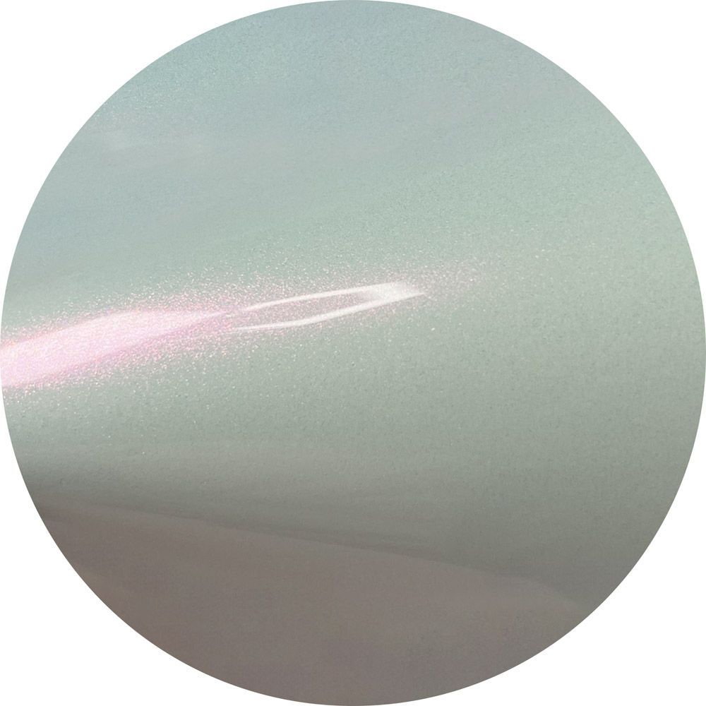 A close up of a white circle with a light coming out of it