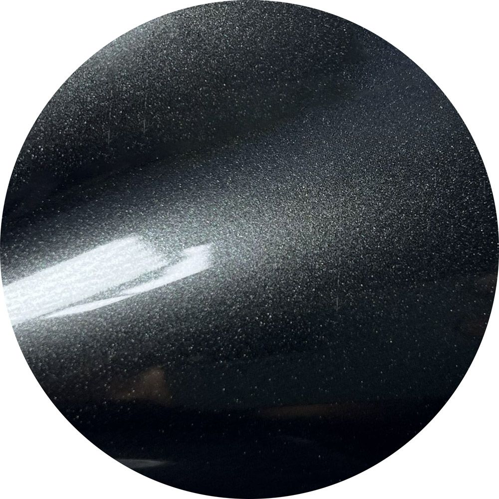 A black circle with white dots on it