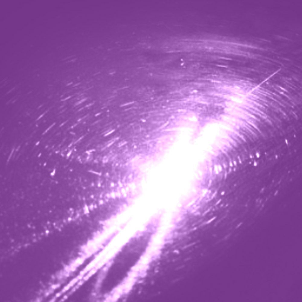 Bright white light bursting from center, streaks against a purple background, with swirling pattern around.