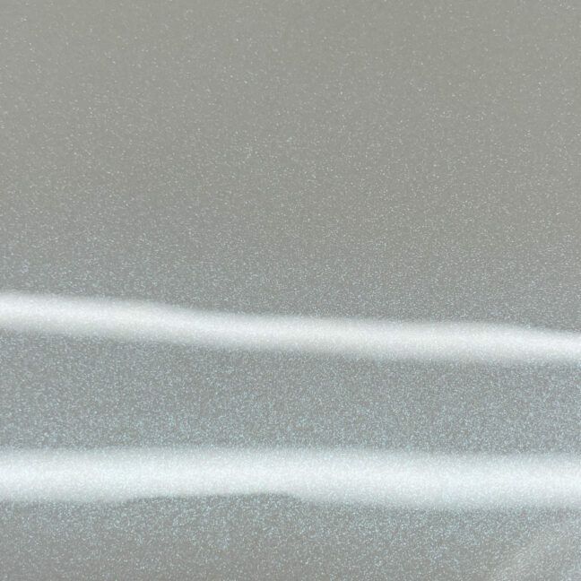 A close up of a gray surface with a white line on it.