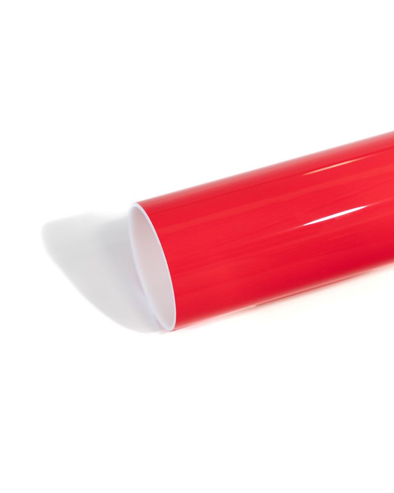 A close up of a red tube on a white background.