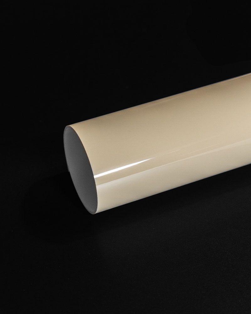A close up of a white tube on a black background