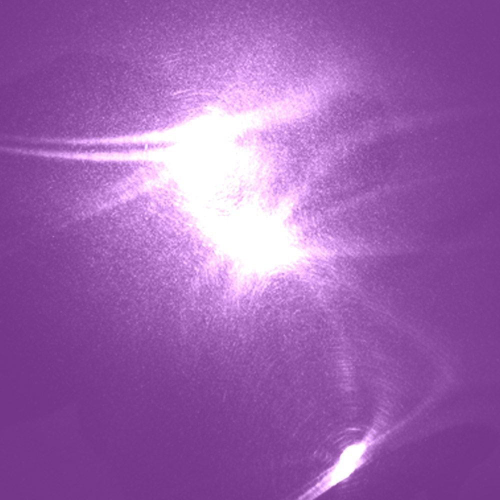 Bright white light burst with streaks and a hazy background in shades of purple.