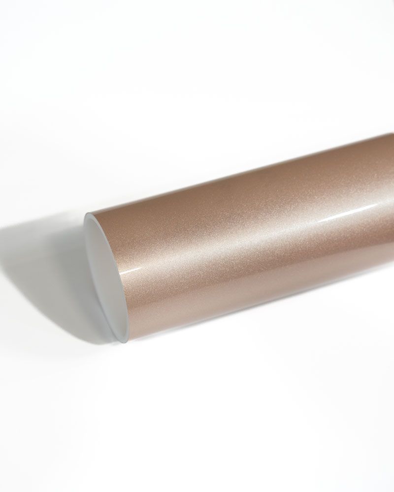 A close up of a metal rod on a white surface.