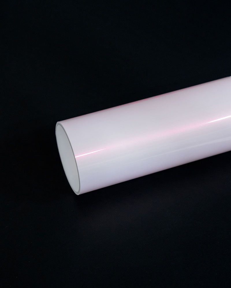 A close up of a white tube on a black background