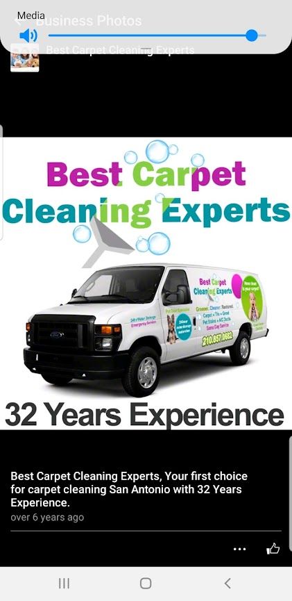 An industrial floor buffer cleaning gray carpeted office tiles near a window.